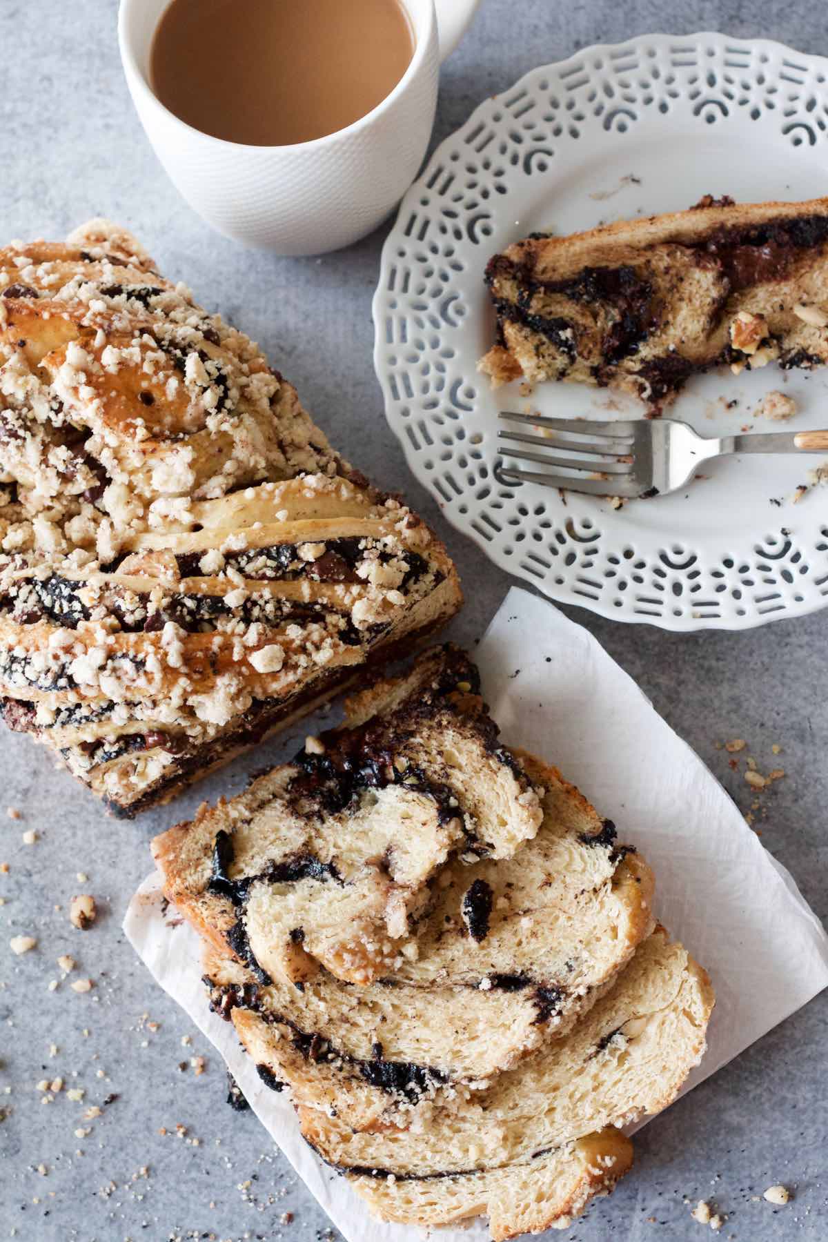 The contrast between the layers of bread and the sticky, delicious swirls of black cocoa, chocolate chips, and cashew nuts make this babka irresistible – It’s difficult to stop at one slice! And while it’s perfect alongside coffee or tea, it is by no means limited to morning consumption and can be all-too-easily eaten as an afternoon snack or dessert.