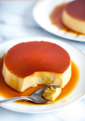 The Ultimate Creme Caramel (Leche Flan) Recipe - a perfect balance of a sweet egg custard with a slight punch of lemon. It’s definitely rich, smooth, and creamy! | www.SpoonfulOfButter.com