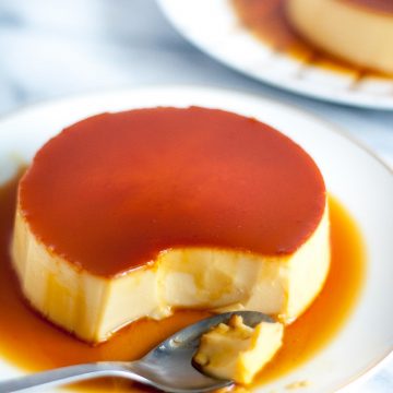 The Ultimate Creme Caramel (Leche Flan) Recipe - a perfect balance of a sweet egg custard with a slight punch of lemon. It’s definitely rich, smooth, and creamy! | www.SpoonfulOfButter.com