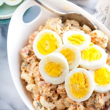 Quick and easy Homestyle Macaroni Salad - a perfect side dish for your summer barbeque. The combination of eggs, carrots, onions, relish, pineapple, and shredded chicken makes this salad extra tasty!