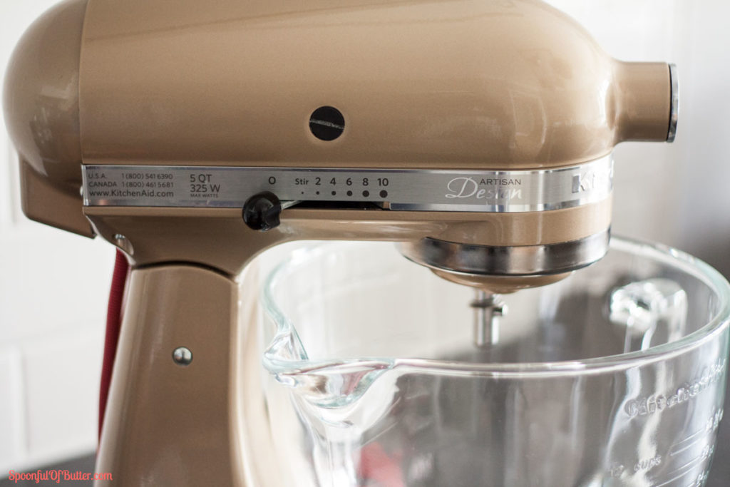 A stand mixer focusing on the speed lever