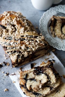 Chocolate Babka | The contrast between the layers of bread and the sticky, delicious swirls of black cocoa, chocolate chips, and cashew nuts make this babka irresistible – It’s difficult to stop at one slice!