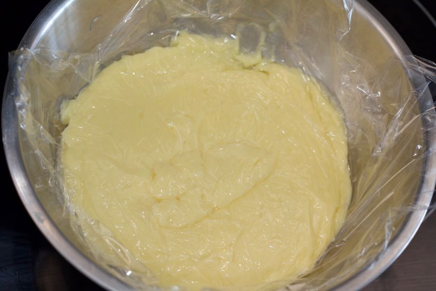 pastry cream in a bowl covered with plastic film