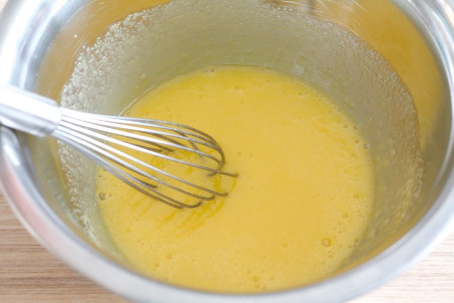 the egg mixture in a bowl mixed using a whisk