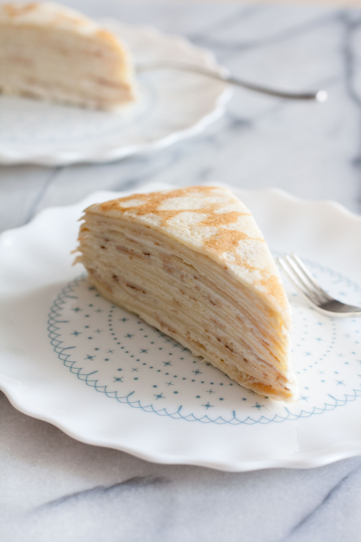 Decadent, classic French cake consisting of 12 layers of paper thin crepes separated with pastry cream, plus variations on how you can serve it in different ways just by adding 1 or 2 ingredients!