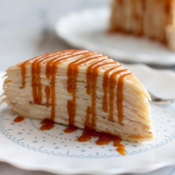 Decadent, classic French cake consisting of 12 layers of paper thin crepes separated with pastry cream, plus variations on how you can serve it in different ways just by adding 1 or 2 ingredients! | www.SpoonfulOfButter.com