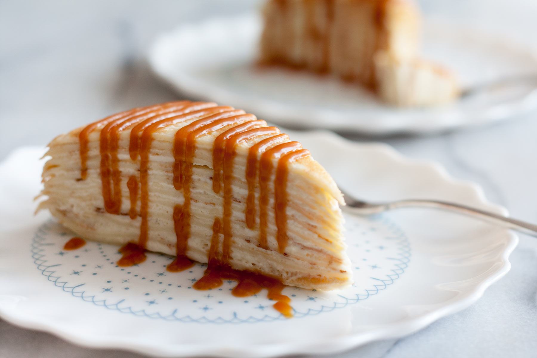 Decadent, classic French cake consisting of 12 layers of paper thin crepes separated with pastry cream, plus variations on how you can serve it in different ways just by adding 1 or 2 ingredients!