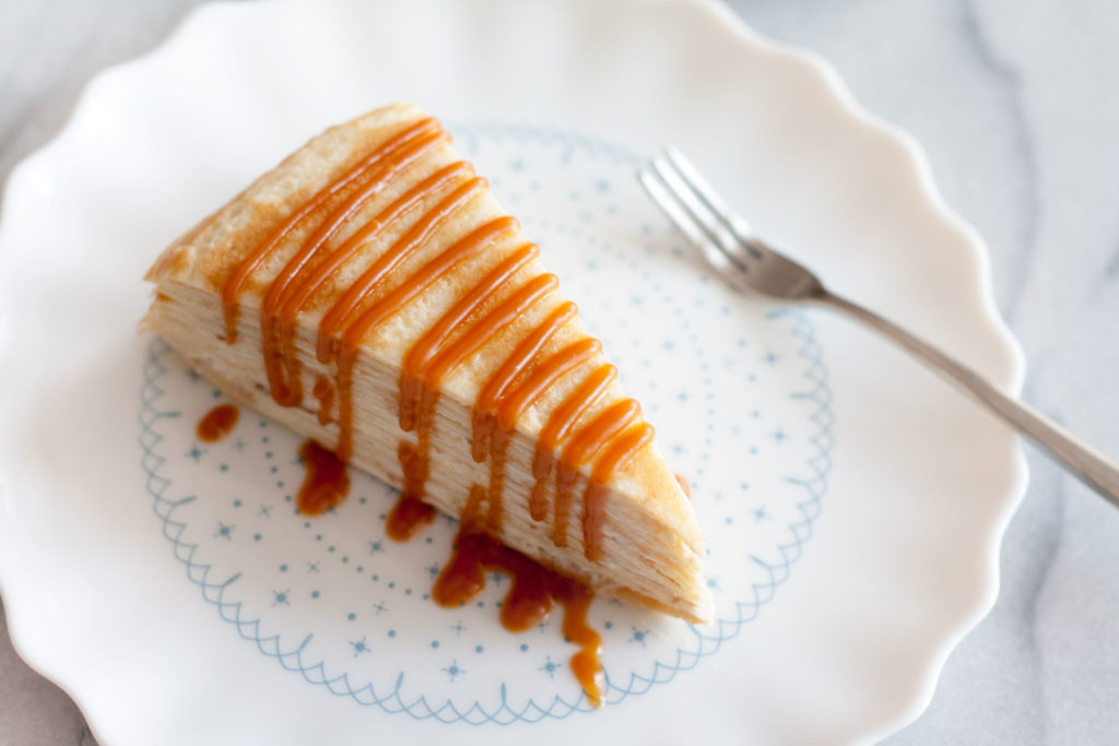 Decadent, classic French cake consisting of 12 layers of paper thin crepes separated with pastry cream, plus variations on how you can serve it in different ways just by adding 1 or 2 ingredients! | www.SpoonfulOfButter.com