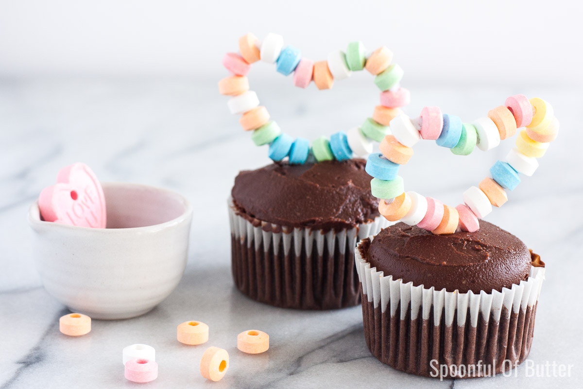 Moist, fluffy chocolate cupcake + luscious whipped caramel frosting + easy DIY heart topper. How cute and delicious is that!