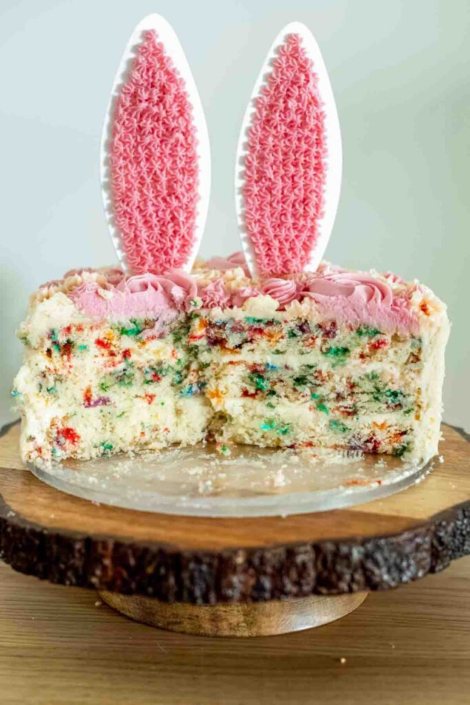 sliced bunny themed vanilla cake showing the inside of a vanilla cake with sprinkles