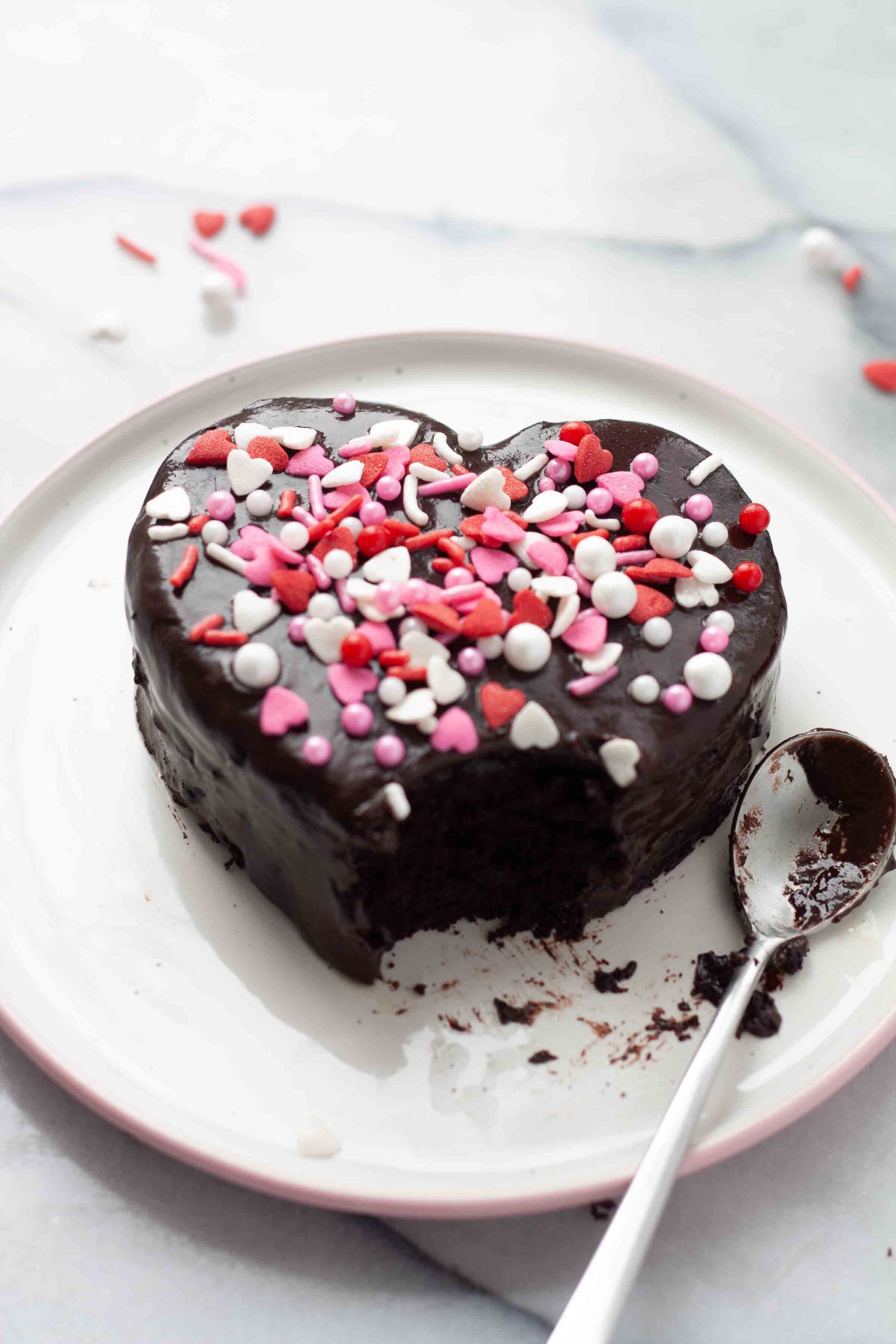 ganache heart with a bite on white plate