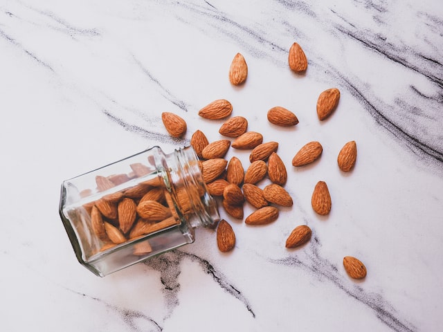 brown almonds on white table