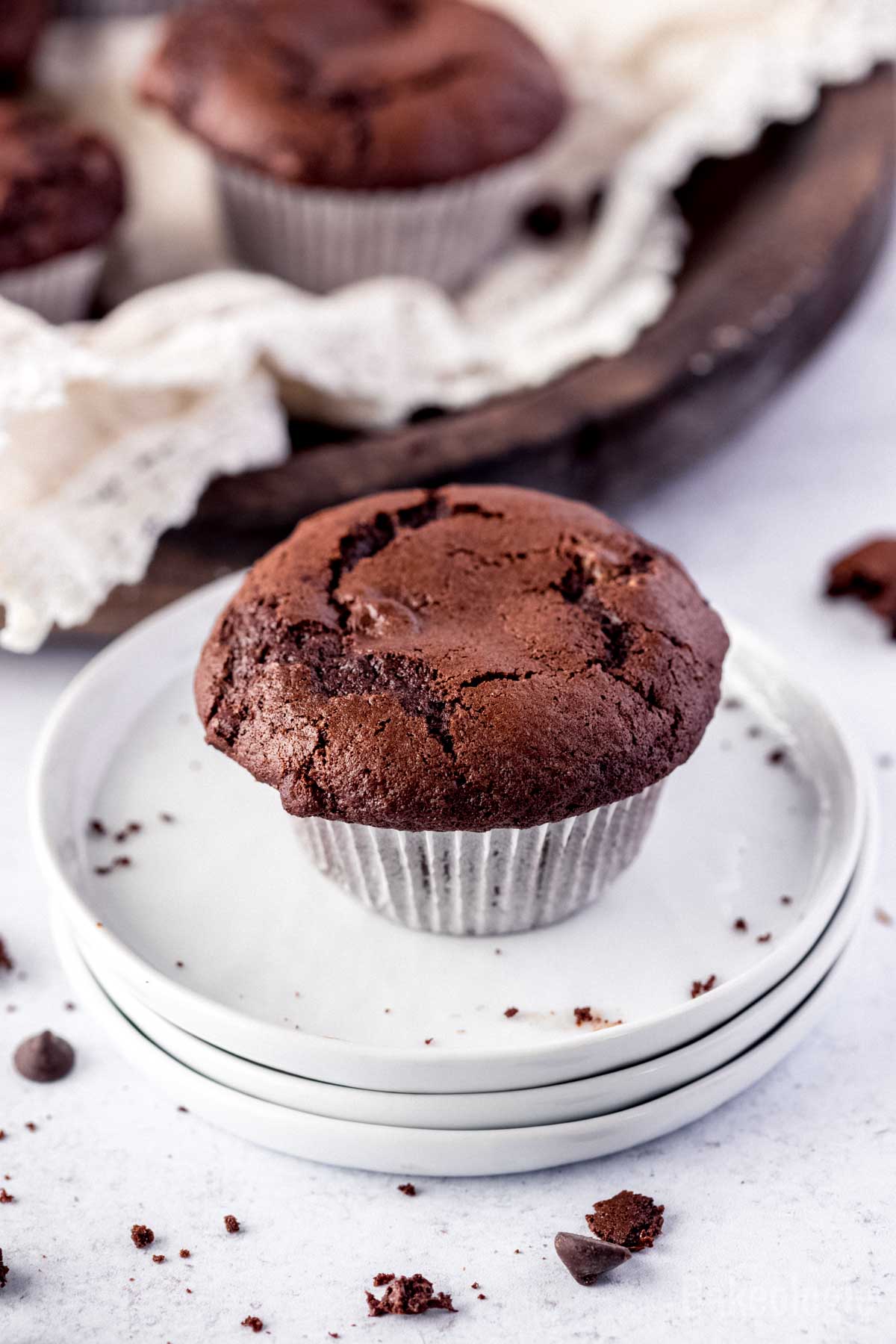 a piece of choclate muffin on a white plate