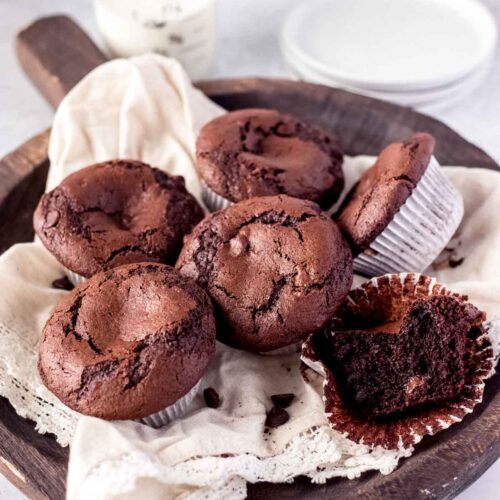 Triple Chocolate Muffins on a wooden tray