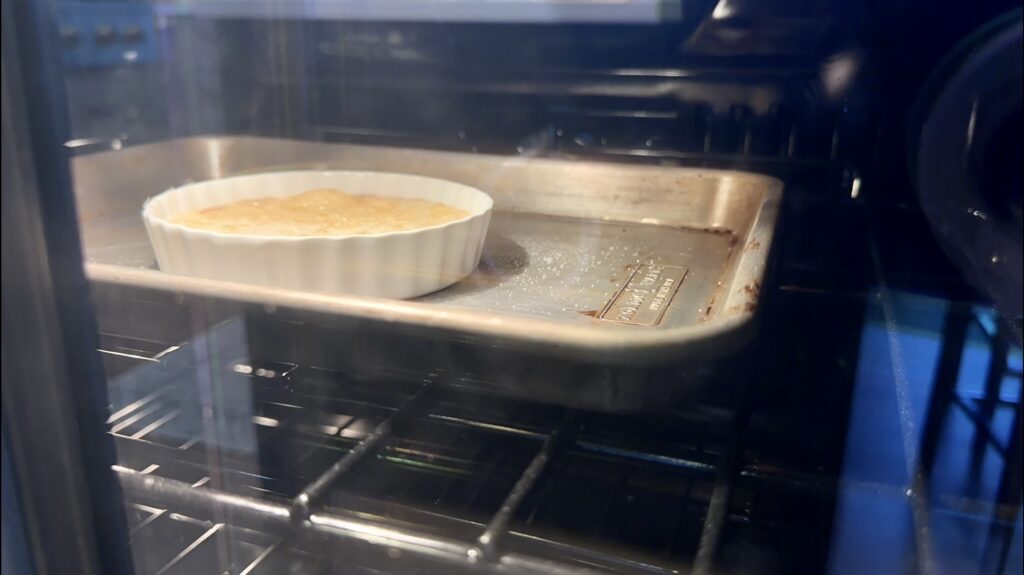 a close-up photo of a creme brûlée under the broiler