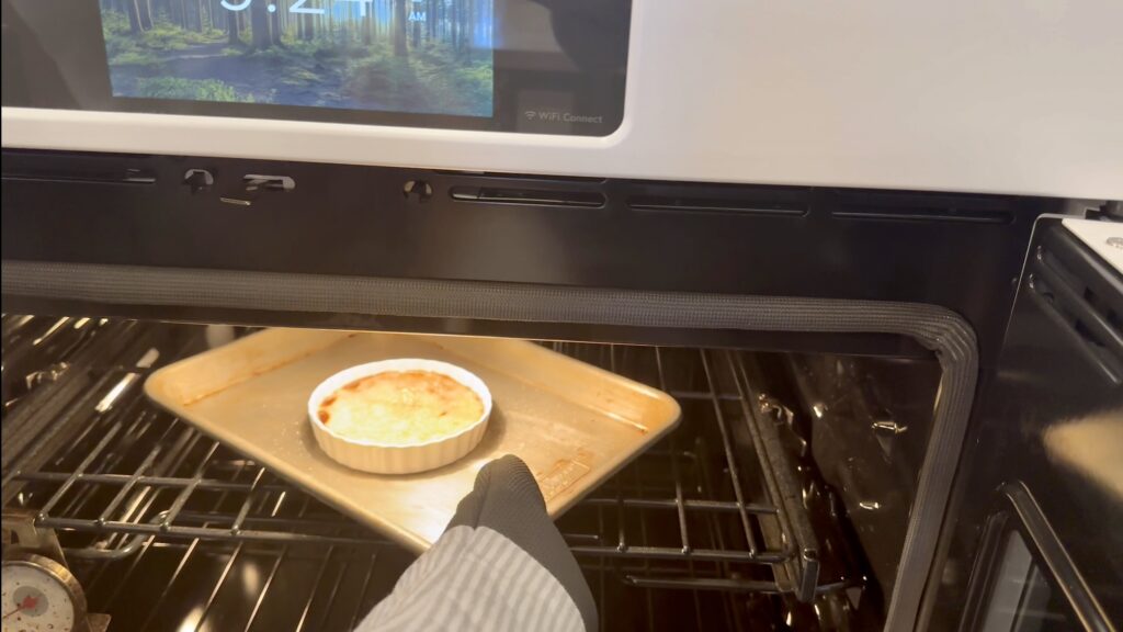 getting the caramelized creme brulee from the oven