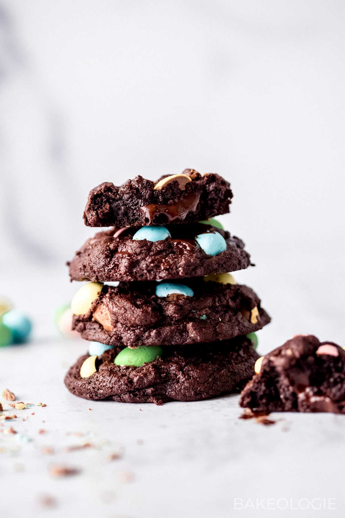 stack of chocolate mini egg cookies with melted dark chocolate oozing out