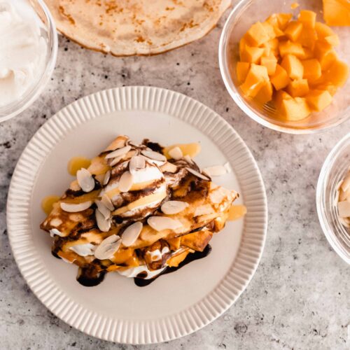 mango crepes on a plate