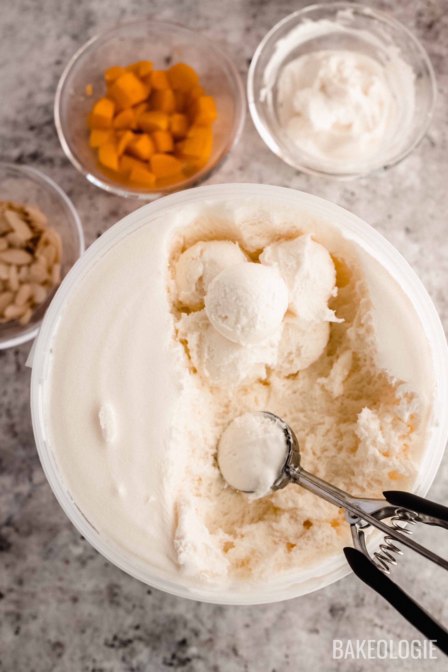 scoops of vanilla ice cream for mango crepes a la mode