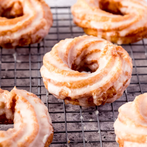 Glazed chouxnuts over a rack