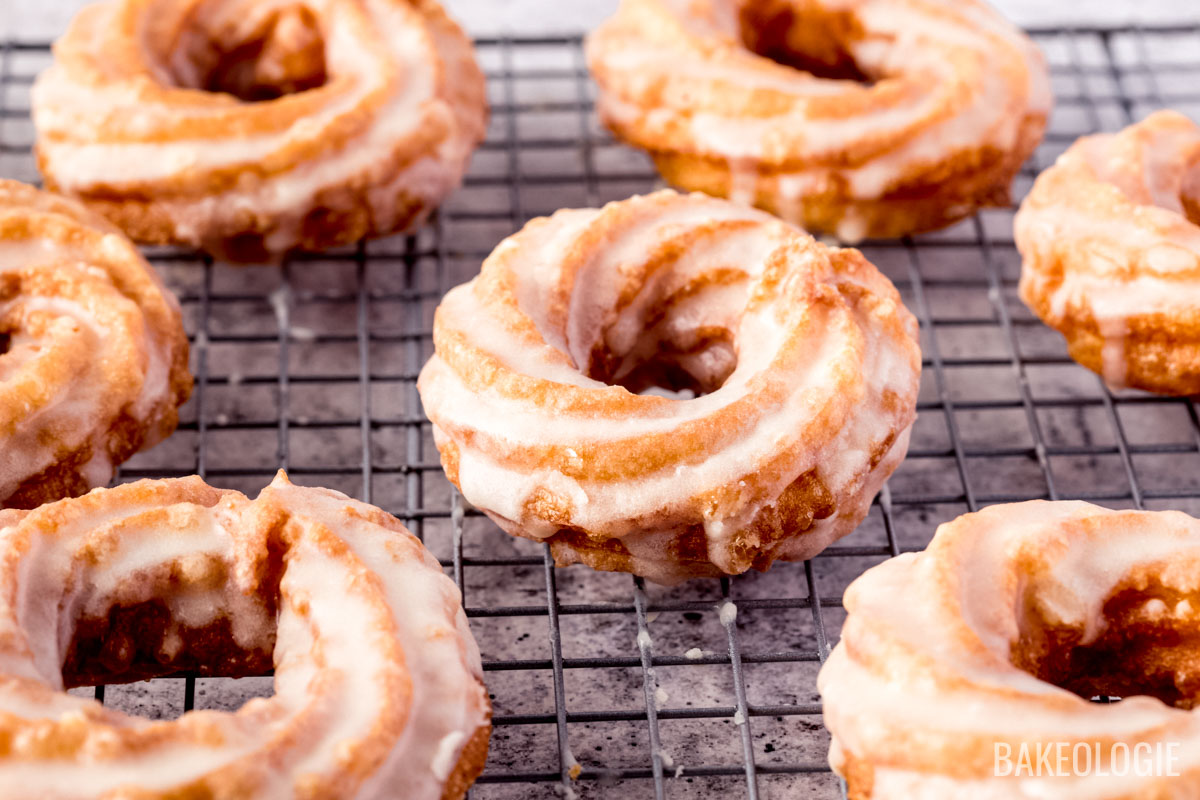 Glazed chouxnuts over a rack