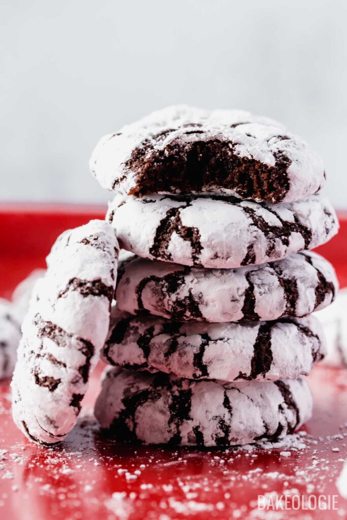 a stack of chocolate crinkle cookies on a tray