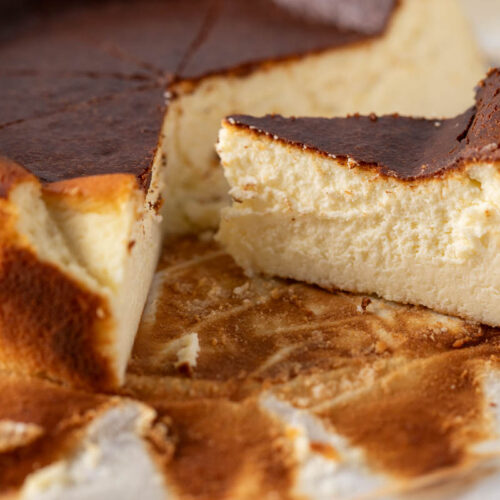 a close-up photo of a slice of san sebastian cheesecake