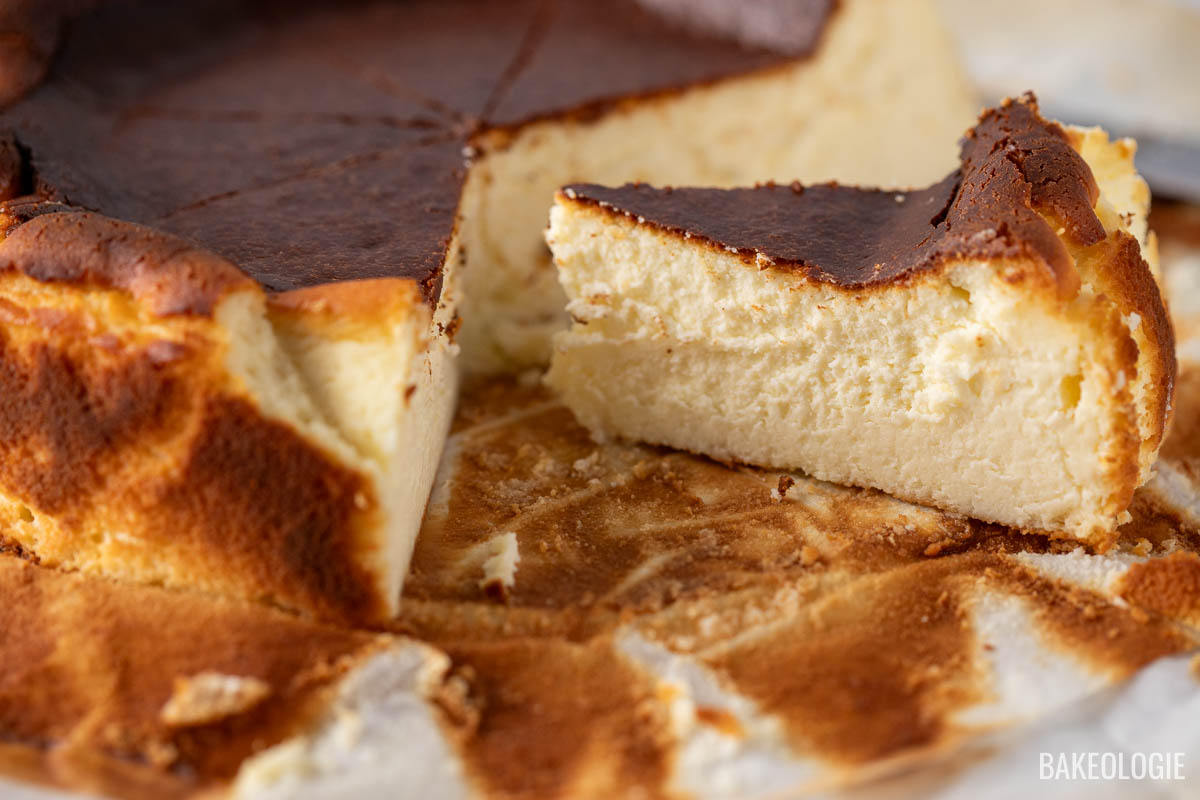 a close-up photo of a slice of san sebastian cheesecake