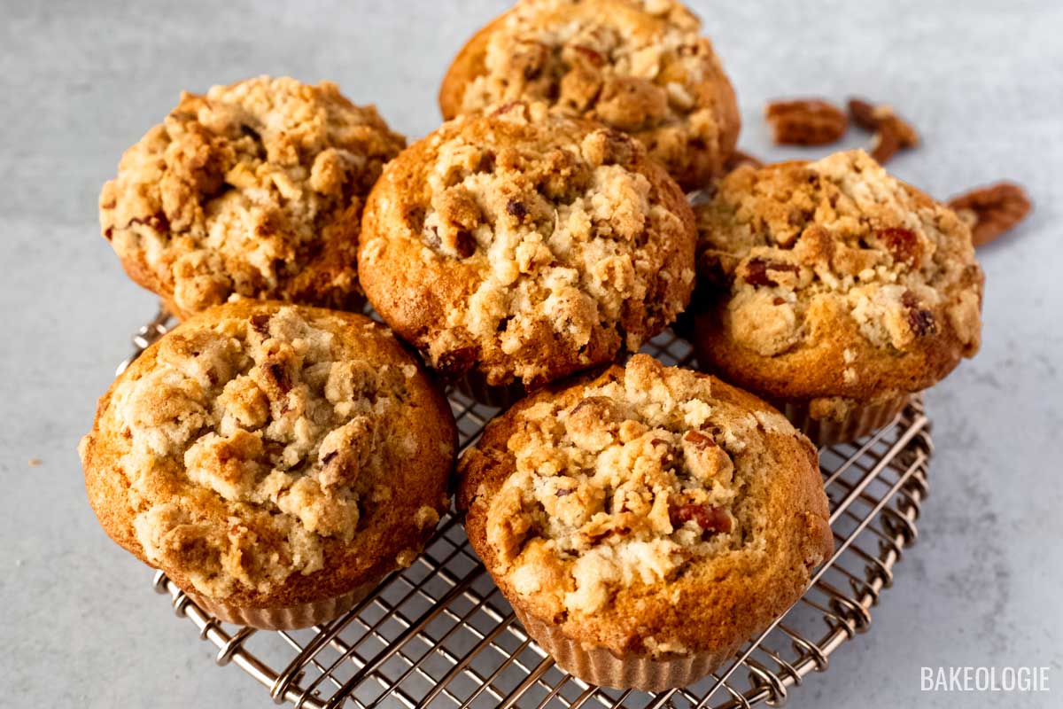 pecan crumb muffins on a round wire rack