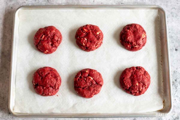 baked red velvet cookies on a sheet pan