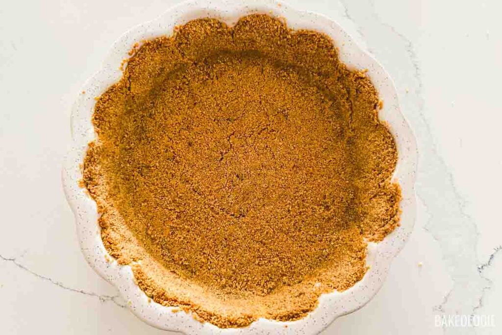 baked graham cracker crust on ceramic pan
