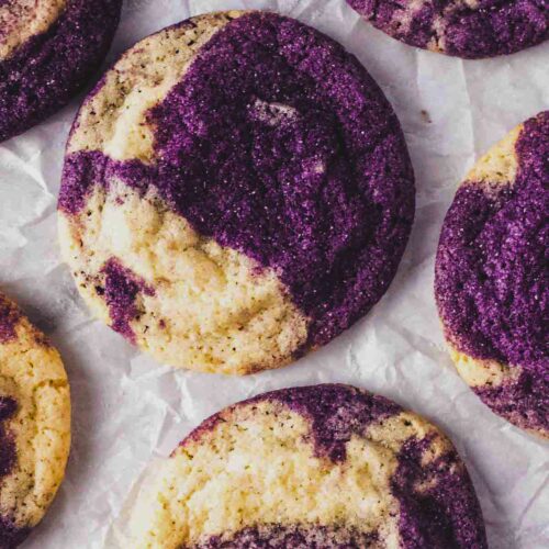 Close-up of marbled ube cookies showing vibrant purple ube and vanilla dough swirls