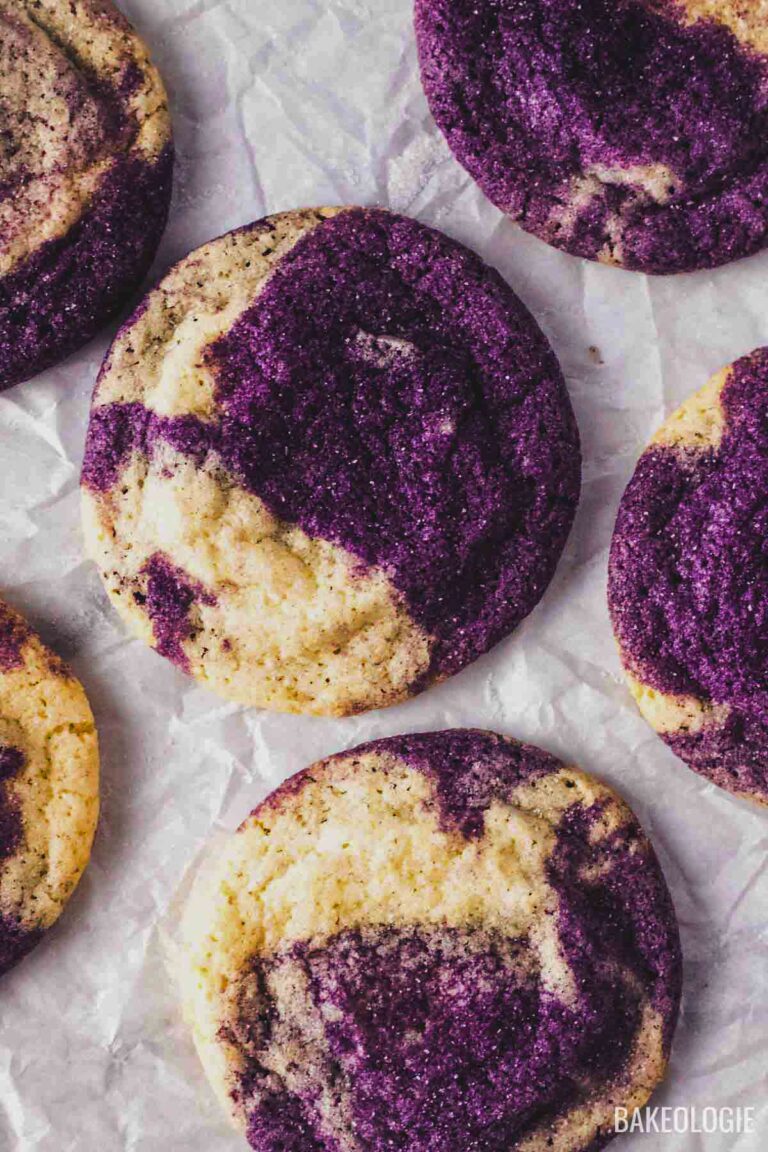 Close-up of marbled ube cookies showing vibrant purple ube and vanilla dough swirls