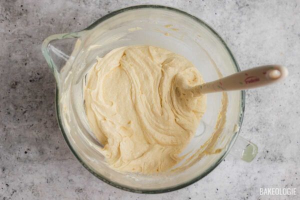 Cream cheese pound cake batter mixed until smooth and thick after adding flour and heavy cream.