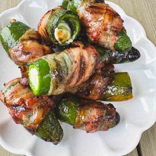 Whole bacon-wrapped jalapeño poppers filled with cream cheese and brushed with a honey butter glaze.