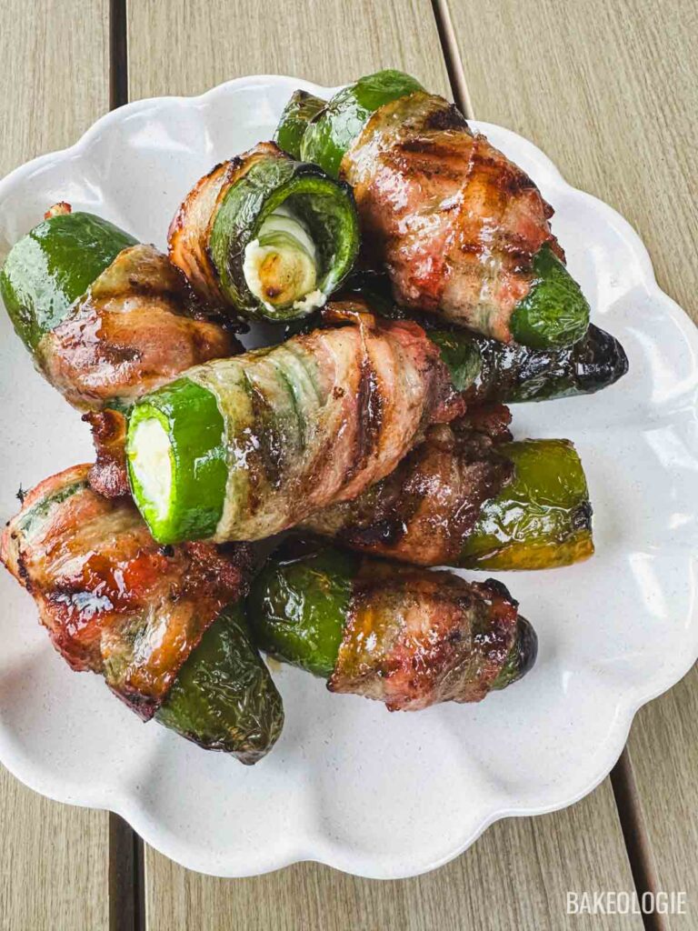 Whole bacon-wrapped jalapeño poppers filled with cream cheese and brushed with a honey butter glaze.