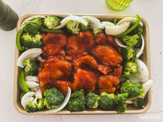gochujang chicken with vegetables ready for baking