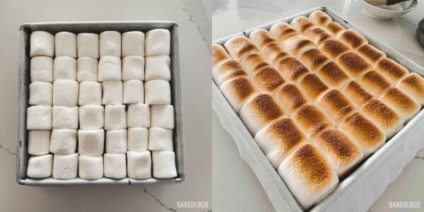 Large marshmallows arranged over melted chocolate before broiling